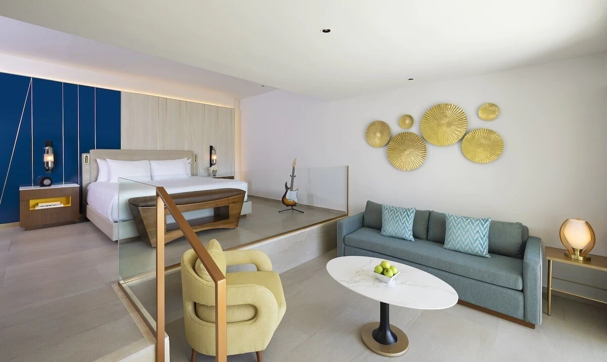 Caribbean Sand Suite — one king bed with sofa bed